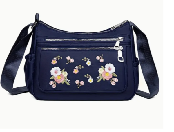 Mala azul impermeável com flores